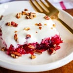 cranberry salad recipe with walnuts or pecans on a white ceramic plate