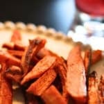 spicy sweet potato fries on a ceramic plate