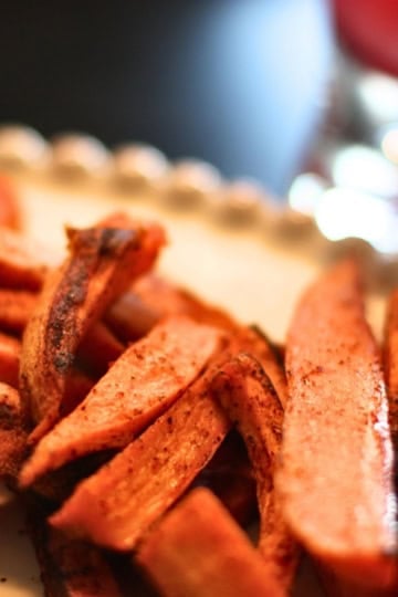 spicy sweet potato fries on a ceramic plate