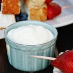 homemade whipped cream in a turquoise ceramic ramekin