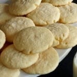 old fashioned drop sugar cookies piled up on a white platter