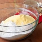 homemade cornbread mix ingredients in a glass bowl