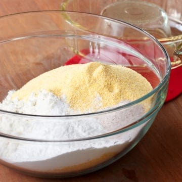 homemade cornbread mix ingredients in a glass bowl
