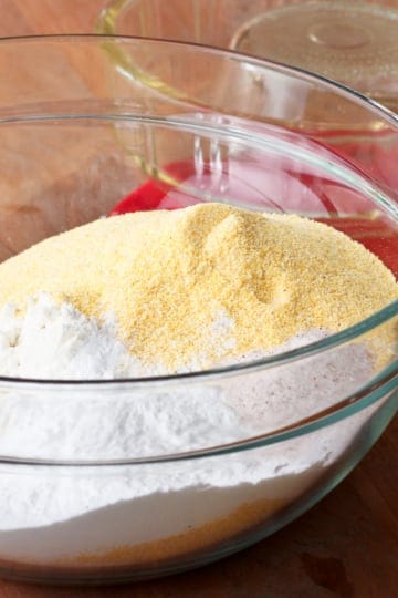 homemade cornbread mix ingredients in a glass bowl