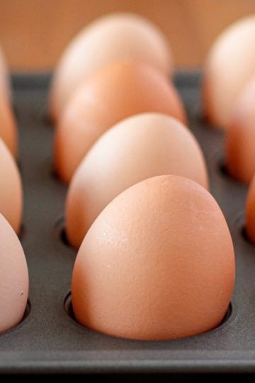 brown hard baked eggs in a muffin tin