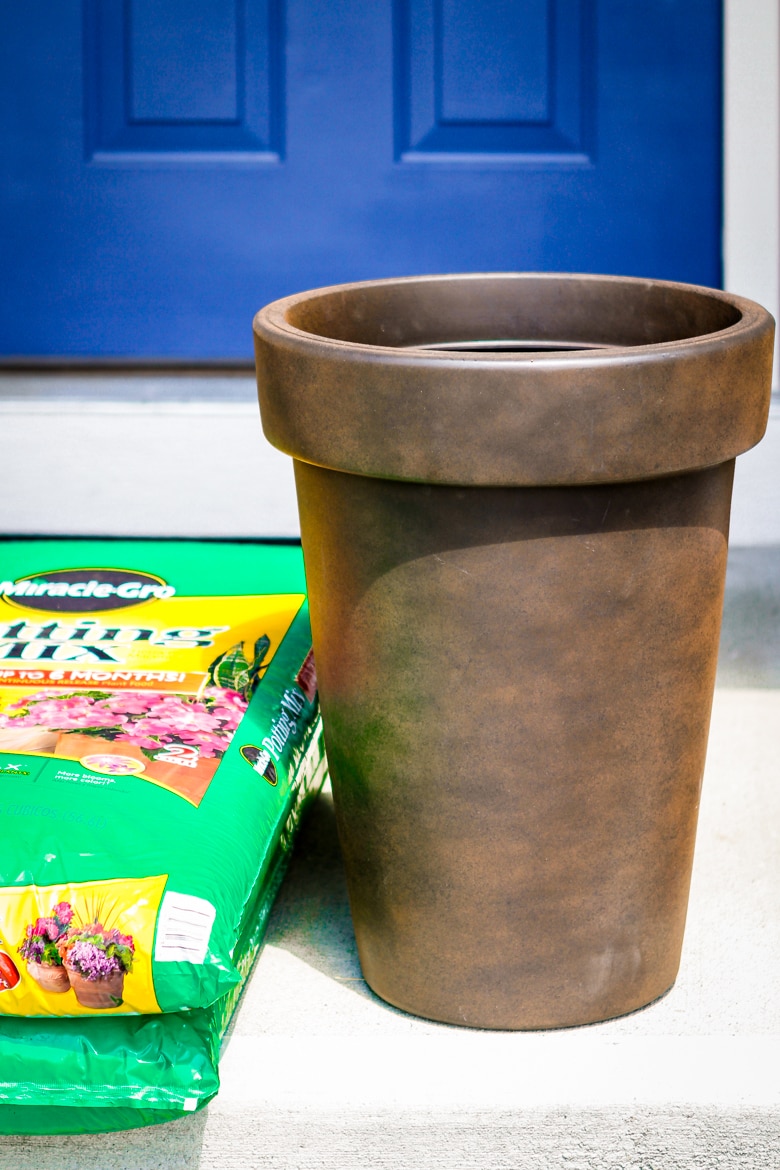 planting flowers in a large flower pot garden vase