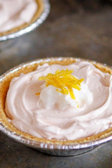 pink lemonade kool aid pie topped with lemon zest