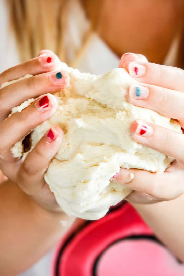 child's hands holding no bake salt dough recipe that's made with just 3 ingredients