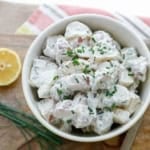 red skin potato salad with chives and a lemon slice