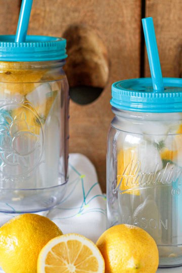 lemon shake ups in plastic mason jar cups with fresh lemons