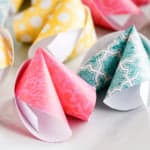 paper fortune cookies made with scrapbook paper on a white tray