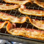 cooked bacon on a wire rack set on a baking sheet