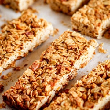crunchy granola bars with pecans on parchment paper