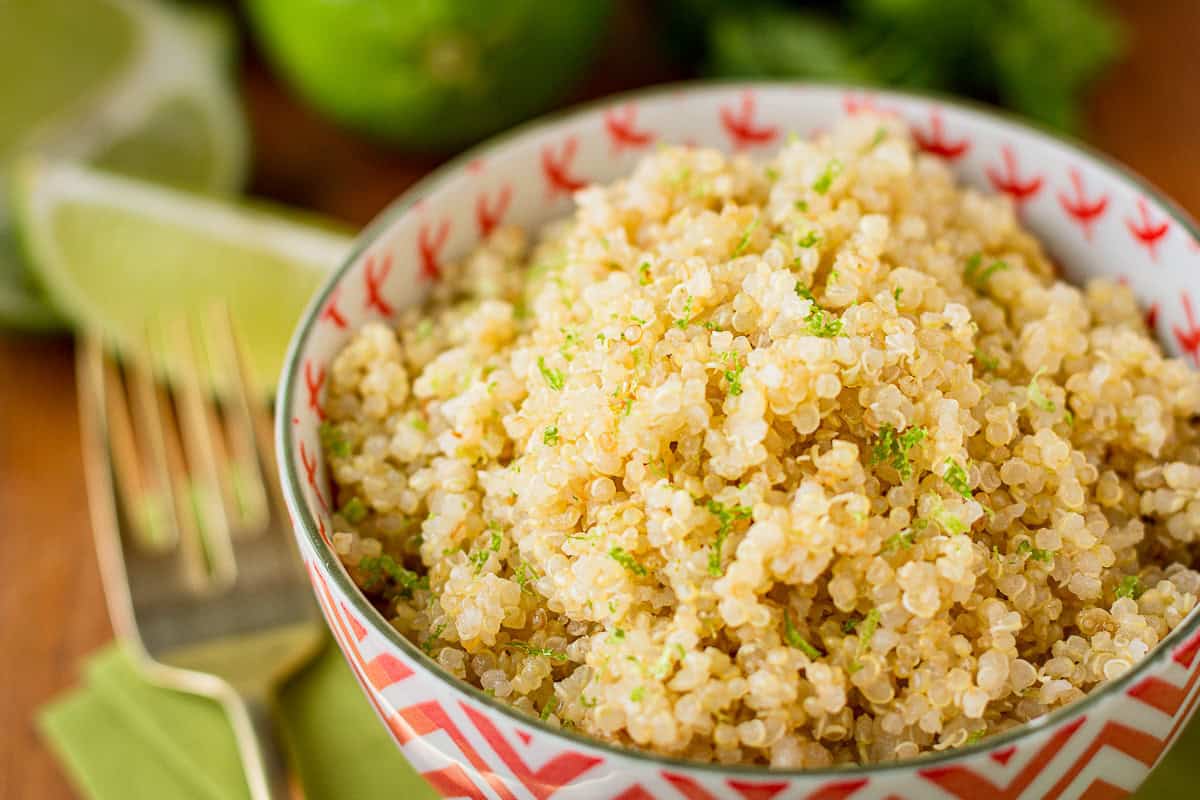 coconut lime quinoa in a bowl with limes