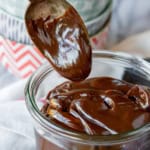 hot fudge sauce on a silver spoon