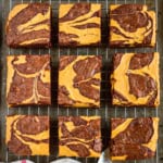 pumpkin brownies swirled with cheesecake cut into squares