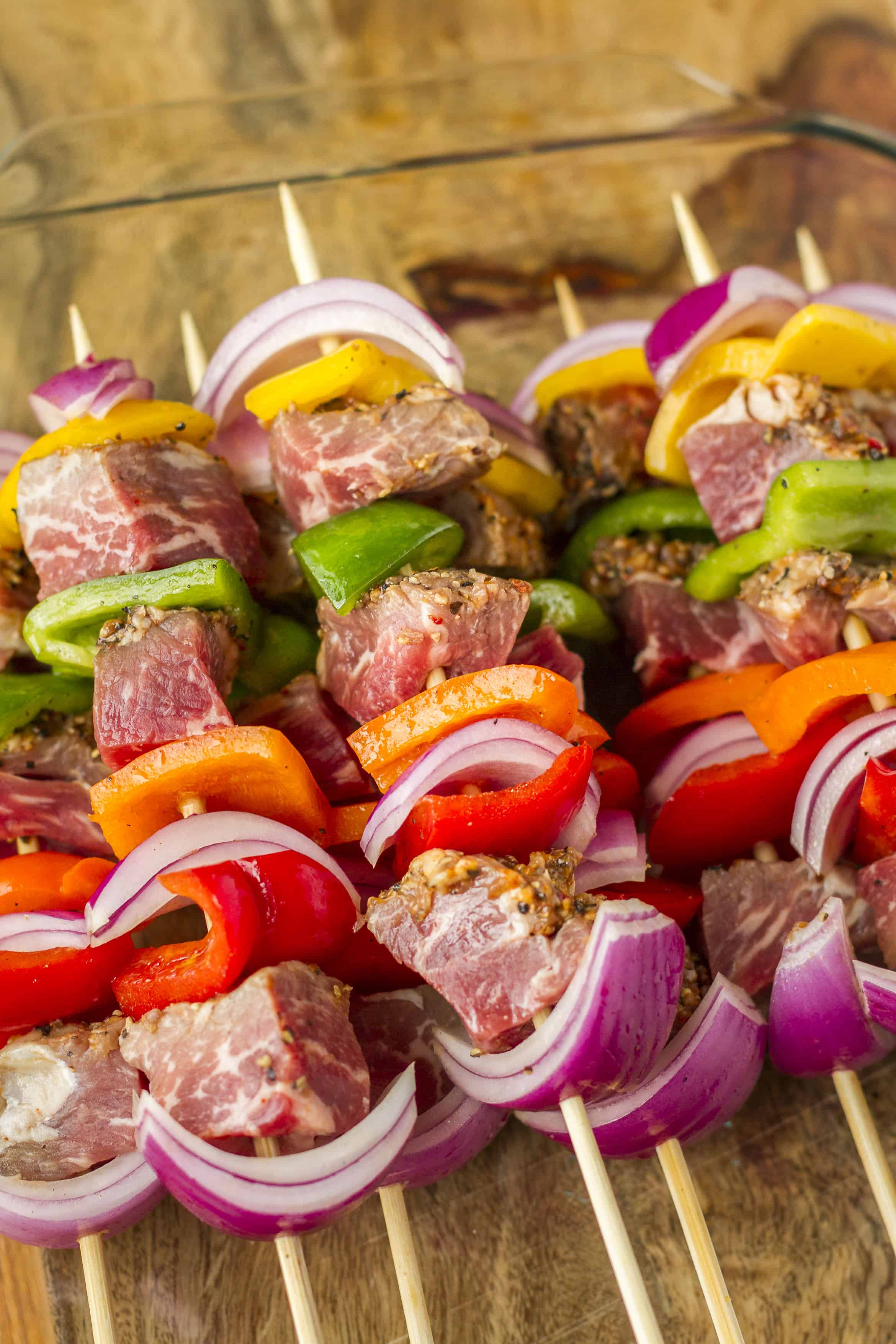 Tri-Tip Beef Kabobs -- Try these delicious tri-tip beef kabobs at your next cookout! Chunks of marinated tri-tip, with colorful red onions and bell peppers, will have your guests lining up for more! | kabobs on the grill | steak kabobs | kabobs recipe | kebabs recipe | get the recipe on unsophisticook.com