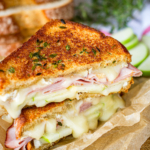 Apple Ham & Brie Grilled Cheese -- this decadent grilled cheese is packed with flavor! Thick bread slathered in fresh thyme butter and filled with green apples, smoked ham, and brie cheese, all drizzled with a touch of honey… | brie grilled cheese | apple brie grilled cheese | honey brie grilled cheese | brie grilled cheese recipe | find the recipe on unsophisticook.com