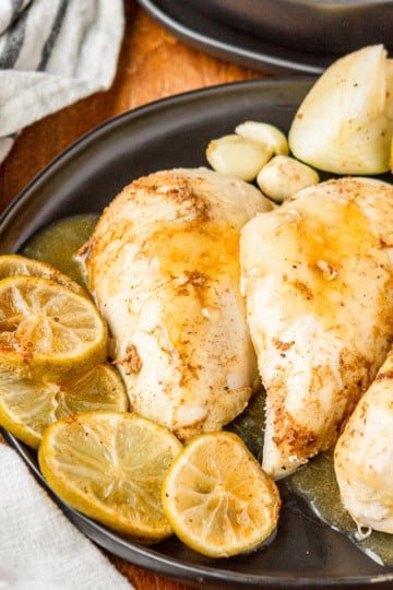 instant pot beer can chicken on a black ceramic platter