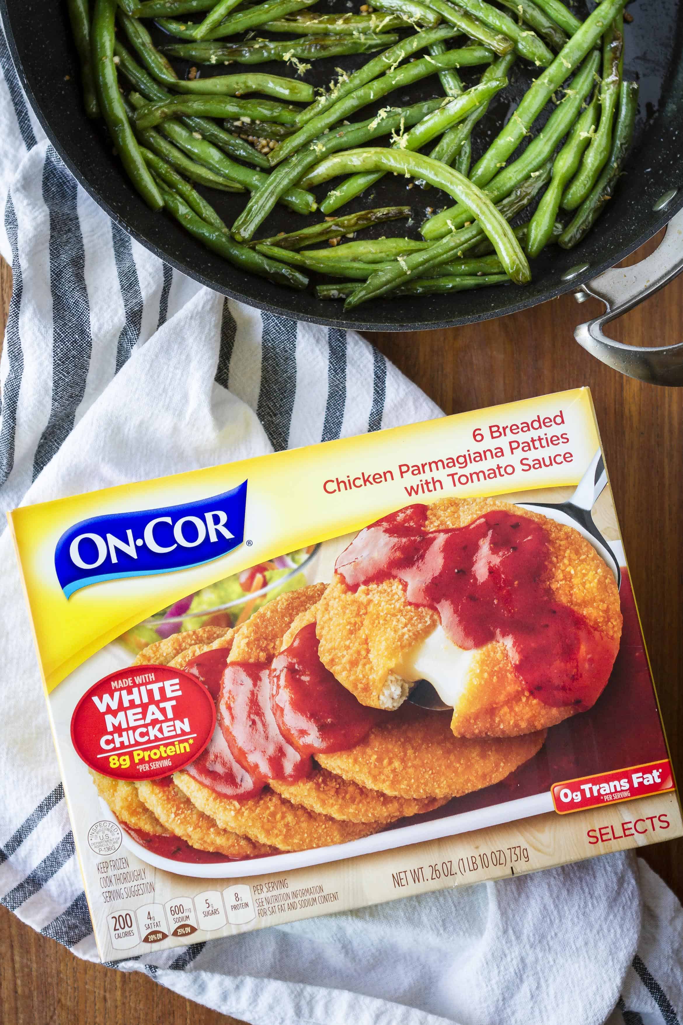 On-Cor chicken parmigiana package with green beans in a skillet