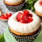 strawberry shortcake cupcakes with black and white polka dotted cupcake liners