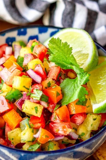 fresh pineapple jalapeno salsa recipe in a blue and white bowl with tortilla chips