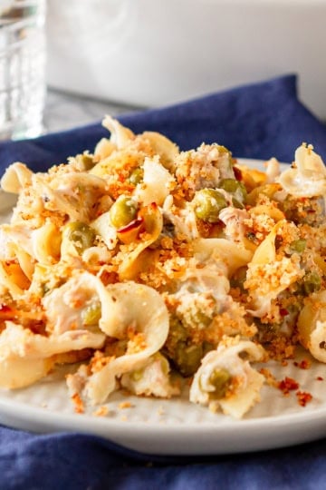 easy tuna casserole recipe topped with bread crumbs plated with a gold fork