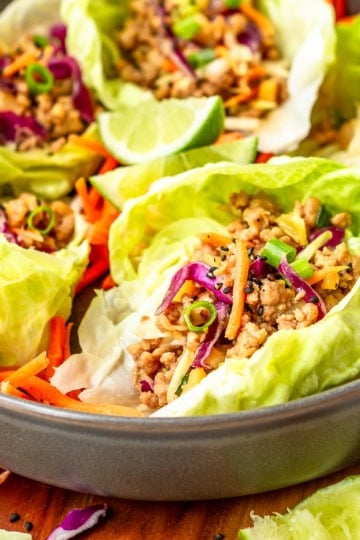 pork lettuce wraps recipe made with ground pork and bibb lettuce in a gray ceramic bowl