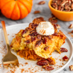 pumpkin dump cake recipe served with homemade whipped cream