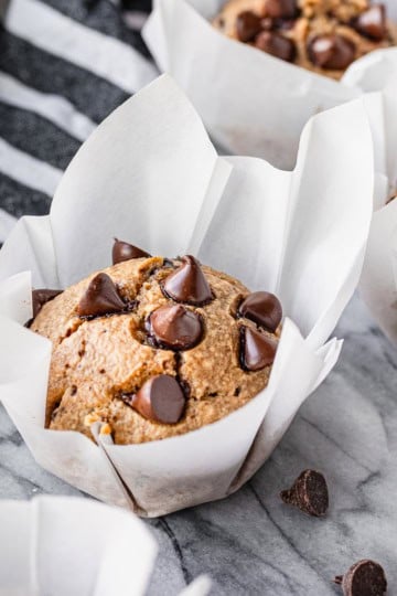 healthy peanut butter banana muffins recipe baked in parchment paper liners