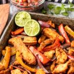 sheet pan chicken fajitas recipe with limes and pico de gallo