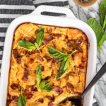 breakfast casserole with bacon recipe in a white ceramic baking dish