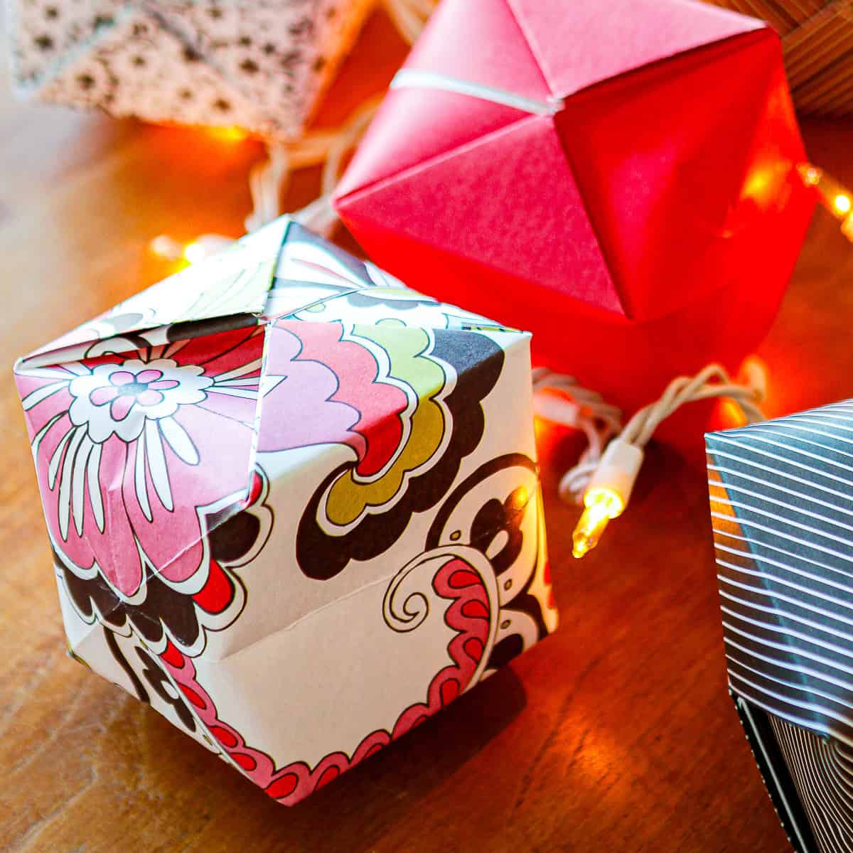 diy origami paper lantern string lights on a table