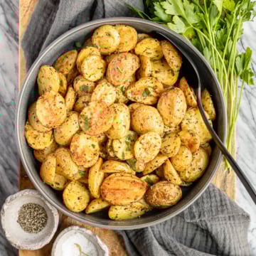 oven roasted baby potatoes recipe in a gray ceramic serving bowl