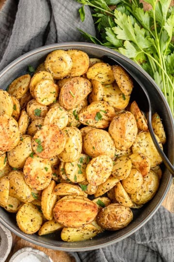 oven roasted baby potatoes recipe in a gray ceramic serving bowl