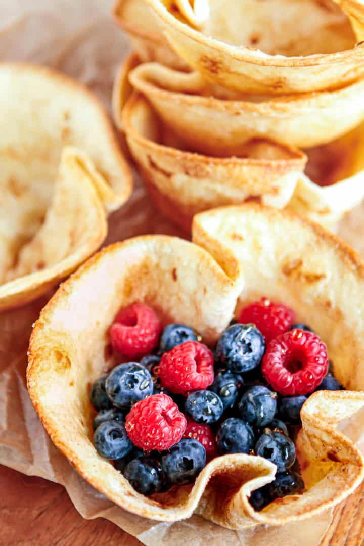 crispy baked tortilla bowls dusted with cinnamon and sugar and filled with fresh fruit