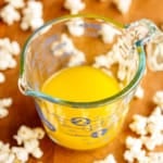 popcorn butter in a glass pyrex measuring cup