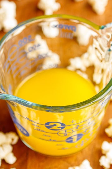 popcorn butter in a glass pyrex measuring cup