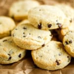 chocolate chip scones stacked up on brown parchment paper