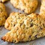 baked cranberry walnut scones on parchment paper