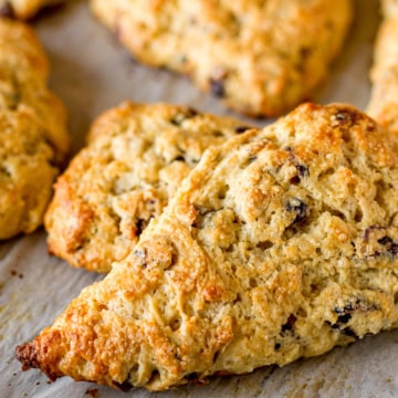 baked cranberry scones on parchment paper