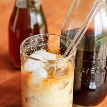 homemade cold brew iced coffee in a glass with a straw
