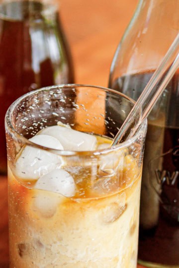 homemade cold brew iced coffee in a glass with a straw
