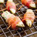 bacon wrapped jalapeno poppers with a toothpick