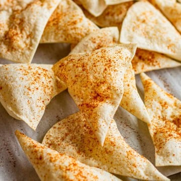 crispy flour tortilla chips dusted with chili powder
