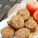 apple bran muffins with pecan streusel on a white ceramic serving tray