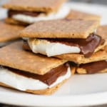 broiled indoor s'mores stacked on a white ceramic plate